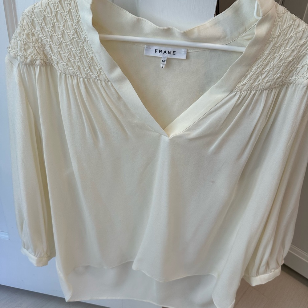 Frame! Like new blouse. Off white . Nice detail front and back! Worn once